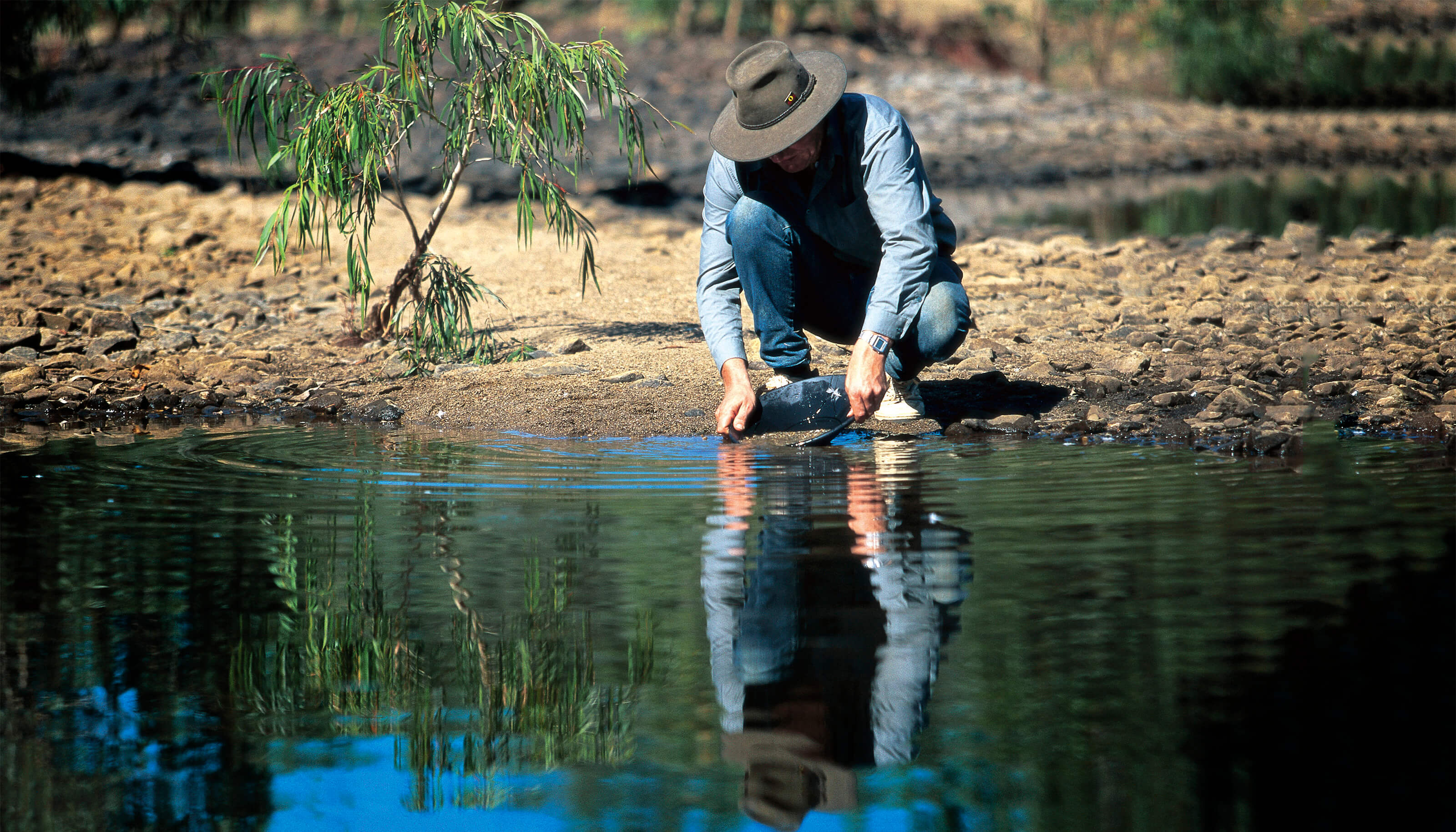 man panning for gems