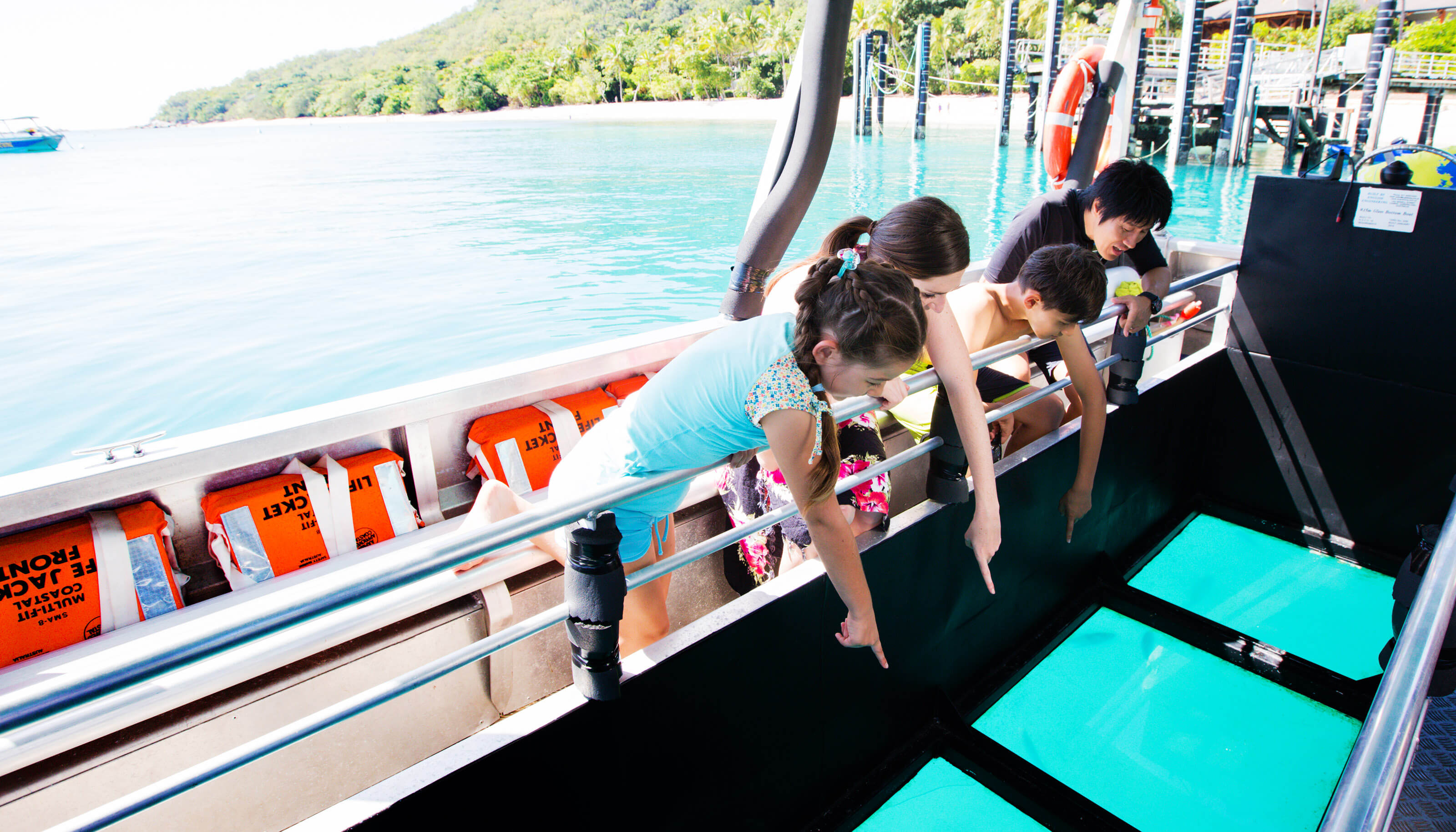 viewing coral by glass bottom boat