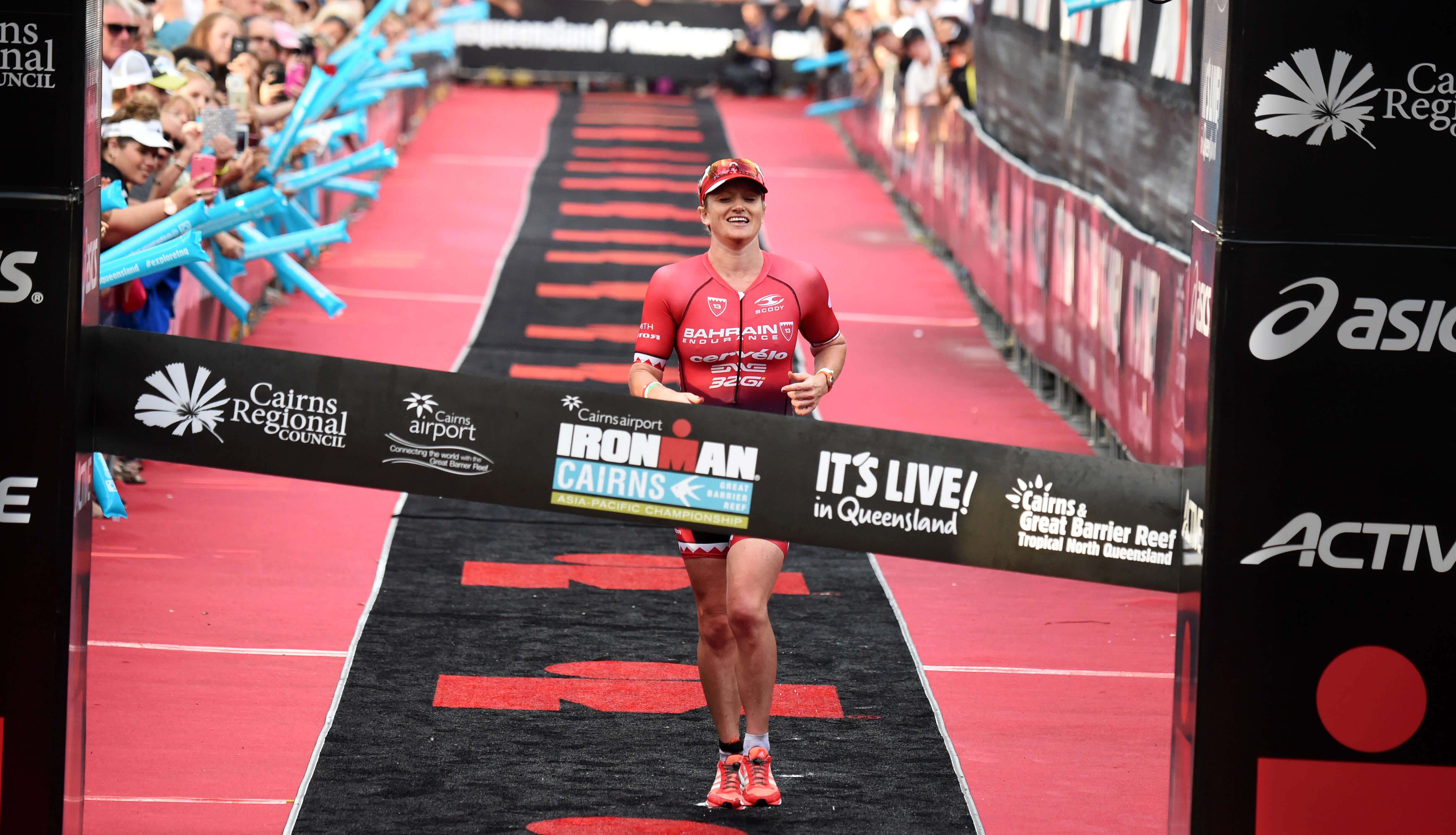 Running across ironman finish line